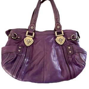 B Makowsky Gorgeous purple leather shoulder bag with silver accents.